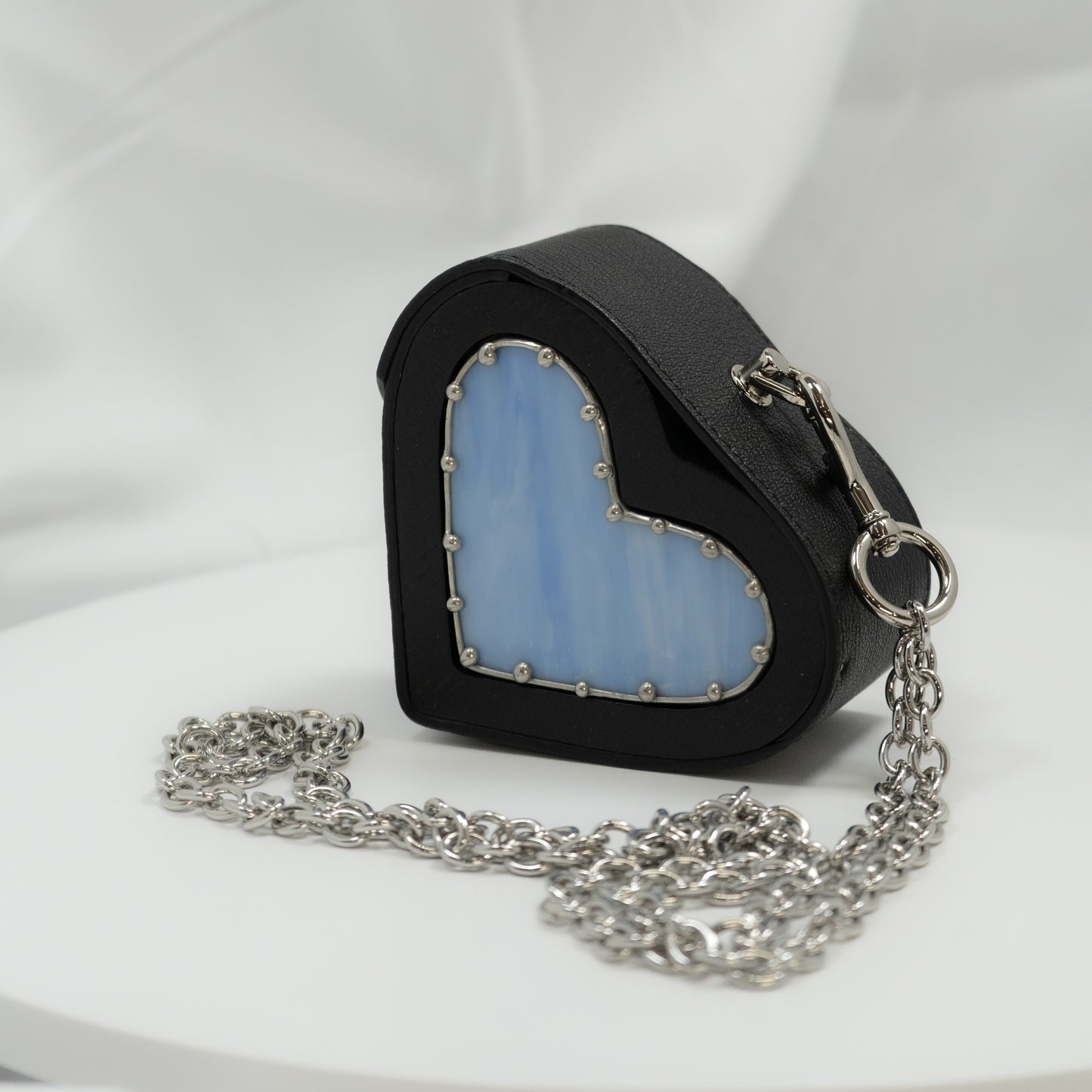 Heart small black with blue glass