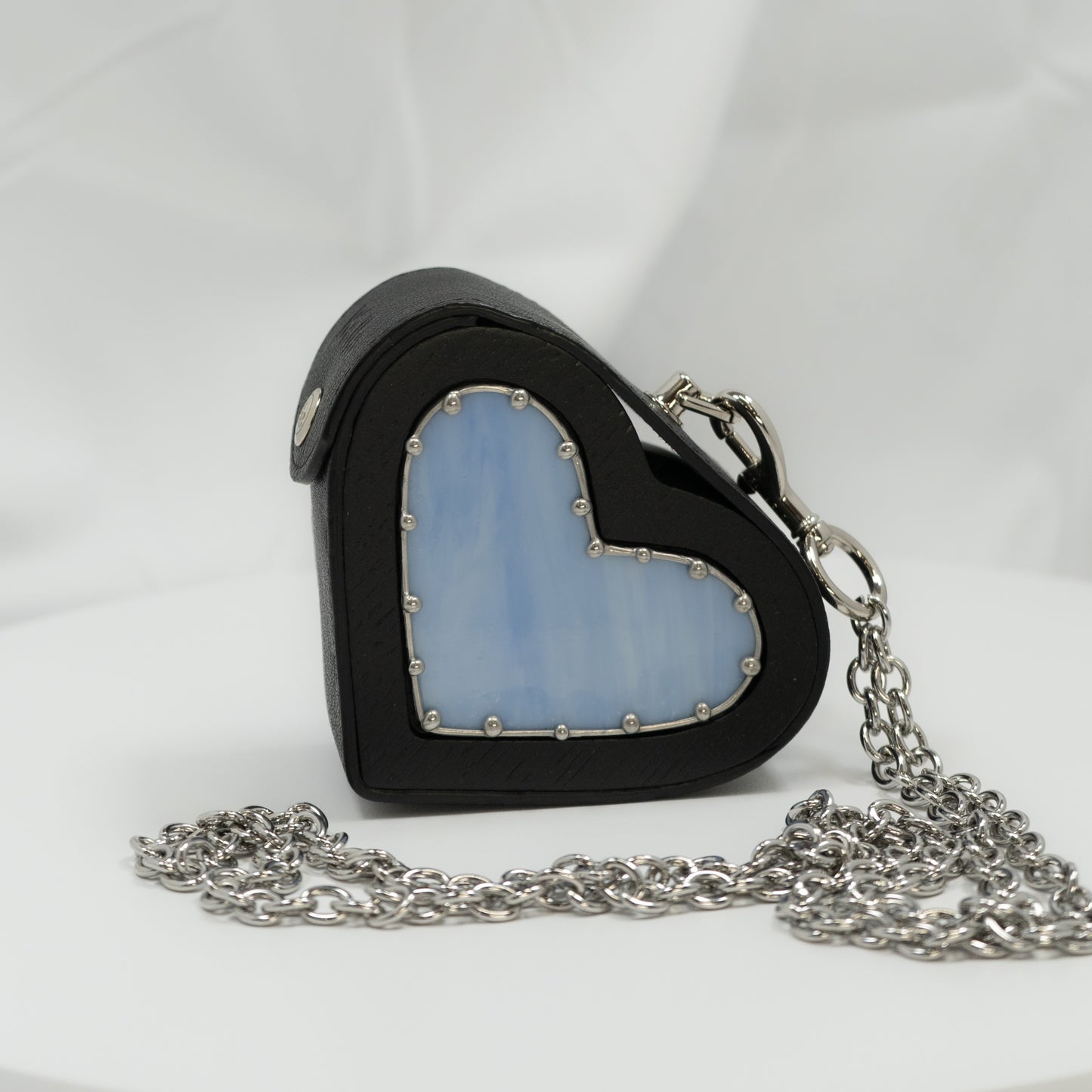 Heart small black with blue glass